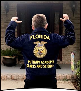 Student wears jacket with Florida Putnam Academy of Arts and Sciences written on the back
